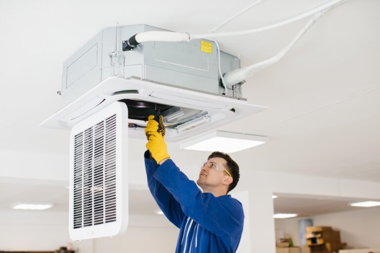Hvac,Technician,Wearing,Safety,Glasses,And,Gloves,Installing,An,Air